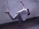Published on 10/1/2004 		山东王村劳教所迫害法轮功学员酷刑图示（部分）---“半飞”：被迫害的大法学员两手被拉直铐在铁架床上，身体半架空，，一只脚被吊起，只能一只脚脚尖点地，半飞着，一弄就是半月。
