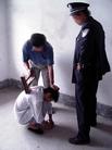 Published on 10/1/2004 山东潍坊劳教所迫害法轮功学员酷刑图示---恶人用马扎子击打在大法学员的背部