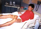 7/30/2001发表.法轮功学员覃永洁被中国警察用烧红的铁条烙伤十三处