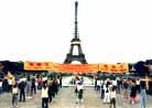 Published on 5/13/2000 Falun Gong practitioners in Paris France hold large group practice in front of the Eiffel Tower, World Falun Dafa Day, 2000.