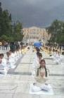 Published on 4/7/2002 Falun Dafa Parade and Large-Scale Practice in the Heart of Athens, Greece Appeals to China to Stop the Persecution. On March 26, Athens saw its first Falun Dafa parade. Over 100 practitioners participated. It started at the square in front of City Hall and went through the pedestrian streets to the Syntagma (Parliament)Square in front of the Parliament. At Syntagma Square the practitioners demonstrated the Falun Dafa exercises and appealed for an end to the persecution in China