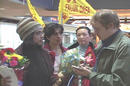 Published on 2/22/2002 四天前返回西雅图，曾同路前往北京请愿的姐姐爱莎（右），与玛苏曼（左）在北京被警察分开监禁，今日终于相聚
