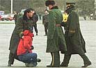 Published on 12/27/1999 Police on the Tiananmen Square Arrests Falun Gong Practitioner