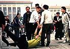 Published on 10/1/2000 A Falun Gong supporter is collared by a military policeman during a protest in Tiananmen Square on Oct 1, 2000