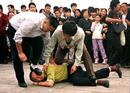 Published on 10/1/2000 AP: Falun Gong Protests Police Pummel Demonstrators