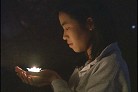 被非法关押在中国的美国法轮功学员李祥春的未婚妻在烛光守夜