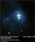 Published on 6/24/2002 the Near Infrared Camera and Multi-Object Spectrometer (NICMOS) aboard NASA’s Hubble Space Telescope captured a series of breathtaking views of galaxies. NASA released some of the pictures in early June. One of the pictures showed a tumultuous collision between four galaxies, called IRAS 19297-0406, located 1 billion light-years from Earth. The galactic collision is creating a torrent of new stars. The large amount of dust generated by the collision is what produces the brilliant infrared glow.