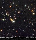 Published on 4/5/2003 All too clear? According to two new studies, Hubble should not be able to snap pictures as sharp as this 1996 image, part of the Deep Field project that discovered hundreds galaxies billions of light-years away.