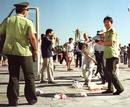 Published on 7/26/2000 Police suppress peaceful protest at Tiananmen Square on the anniversary of the start of the persecution of Falun Gong in China.