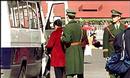 Published on 3/16/2001 Police take woman to police van after she made peaceful appeal for Falun Gong at Tiananmen Square.
