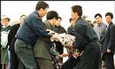 Published on 4/27/2000 Security guards take Falun Gong practitioners by force after they practice the exercises at Tiananmen Square.