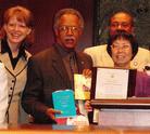 Published on 5/21/2004 Member of Atlanta City Council, Mr. Martin (second from left) issues proclamation. Falun Gong practitioner accepts the award and presents the book Falun Gong. 2004