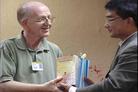 Published on 6/23/2004 Library director receiving Falun Gong books and video tapes donated by practitioners to the library during the celebration of the first Imperial County Falun Dafa Week on June 19, 2004, California.
