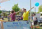 Published on 5/19/2001 Teaching Dafa excercises in front of the display boards.