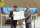 Published on 5/13/2001 A practitioner accepts the proclamation from the Mayor.