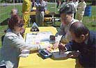 Published on 5/13/2001 A practitioner writes "Zhen Shan Ren" with traditional brush and draws beautiful lotus flowers.