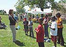Published on 5/13/2001 A practitioner teaches Dafa exercises.